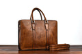 Men's 14-inch vegetable tanned leather handbag in horizontal square design with zipper