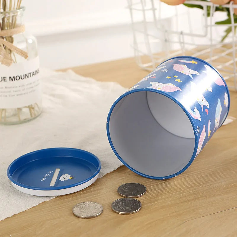 British style creative metal piggy bank on a wooden desk, showing coin slot.