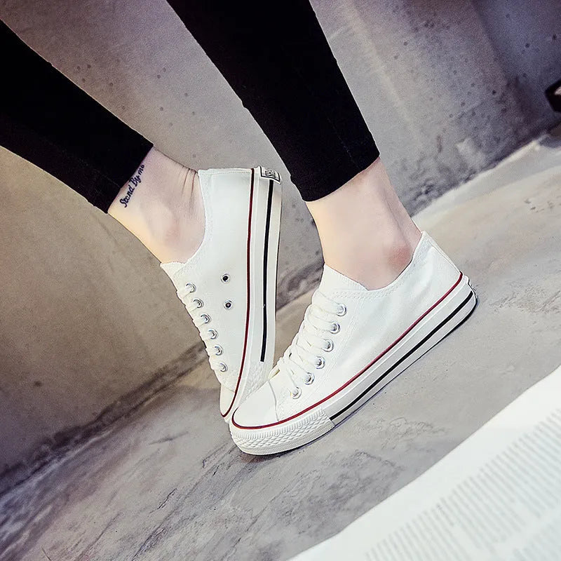 Women's casual canvas shoes in solid colours showing black, white black, white red and all black options