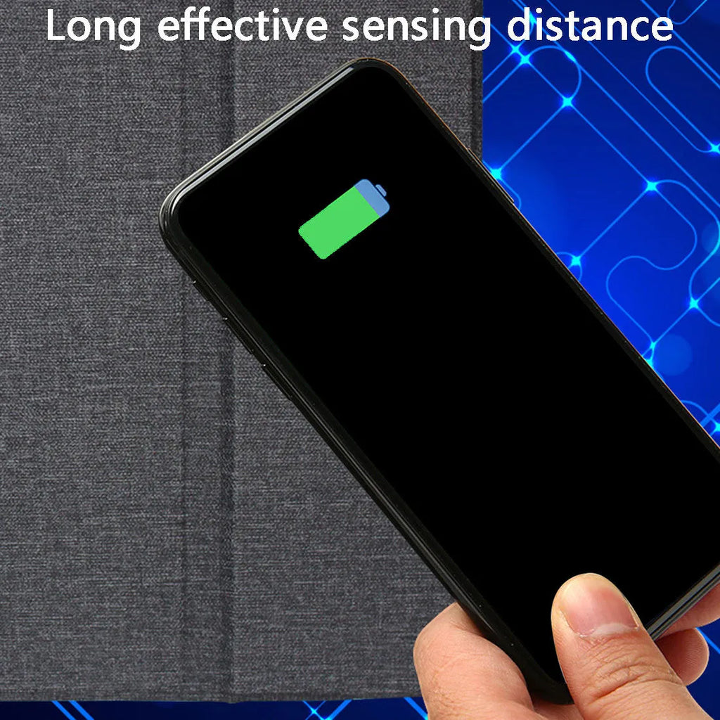 Black 2-in-1 wireless charging mouse pad on a desk with a phone resting on the built-in bracket
