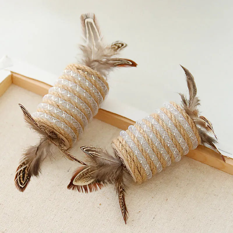 Beige cat toy with hemp rope scratching post, feathers, and a built-in sound roller on a neutral background.