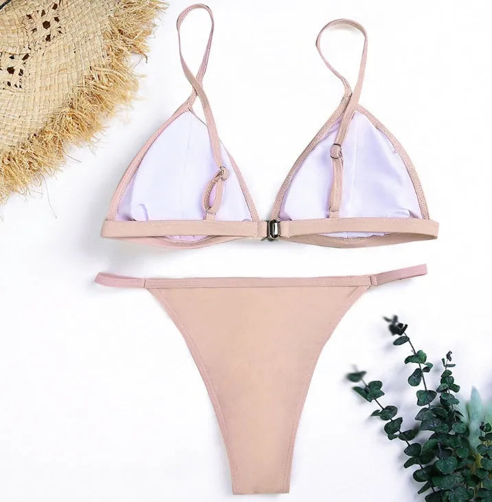 Women's pink crystal bling diamond bikini set with push-up top and Brazilian low-waist bottom on model
