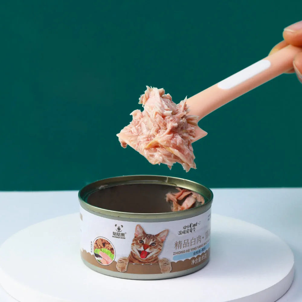 Green TPR pet feeding spoon with long handle and angled scoop for canned food