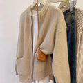 Beige long sleeve cardigan-style sweater coat made from soft viscose fibre fabric.