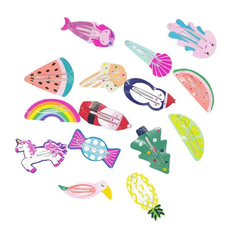 Close-up of a children's metal barrette with a colourful painted strawberry print and baking varnish finish.