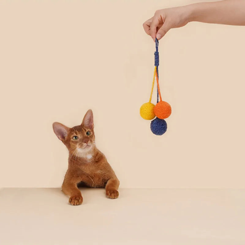 Four-piece cat toy set showing teaser stick and coloured, bite-resistant catnip balls.