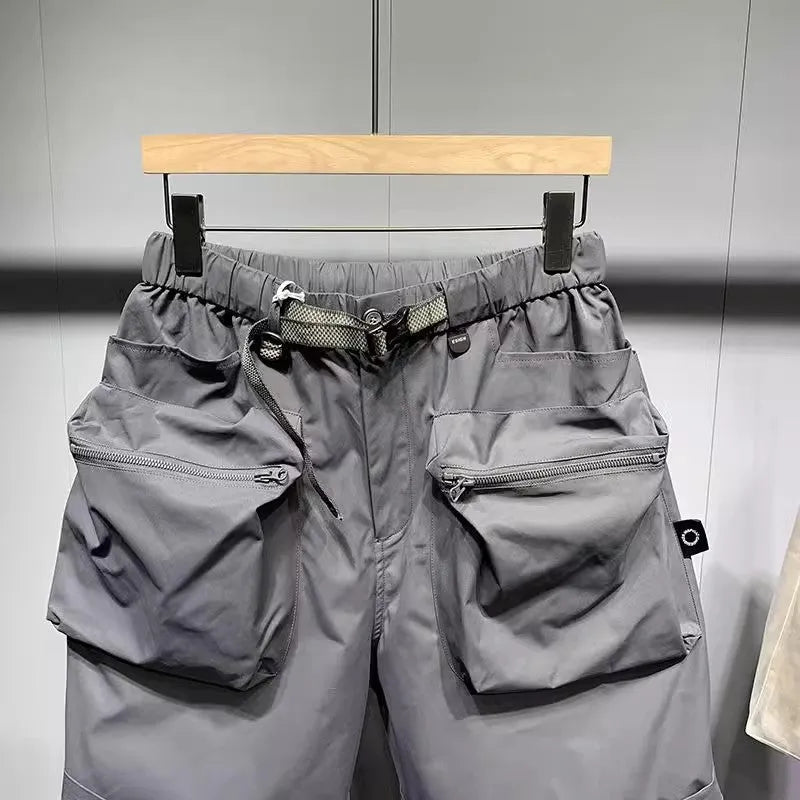 Men's black workwear shorts with multiple pockets and loose fitting design