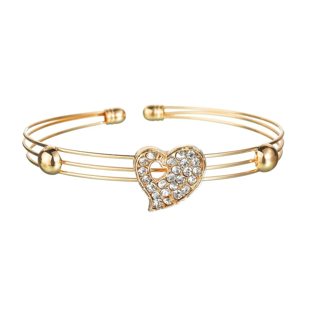 Women's gold electroplated alloy jewellery set with earrings, necklace and bracelet featuring Love, Water Drop and Bell patterns