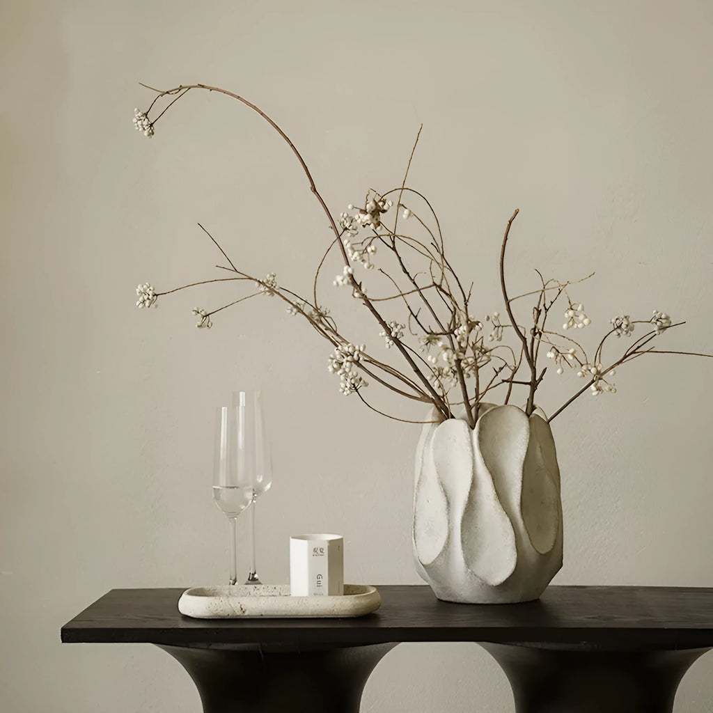 Irregular ceramic art vase in magnesium clay material showing textured finish and distinctive handmade shape