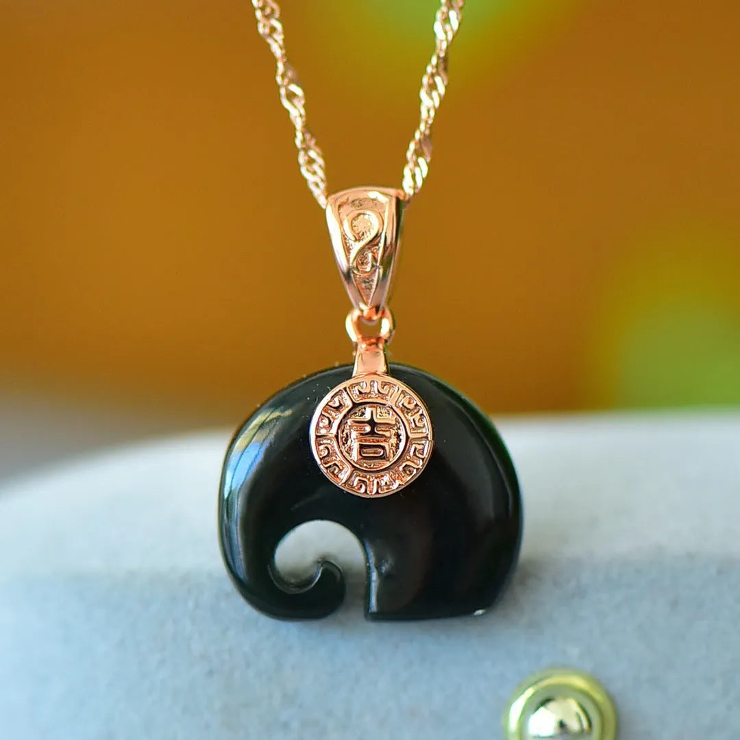 Flat Hetian jade pendant necklace with copper inlay on a gray background.