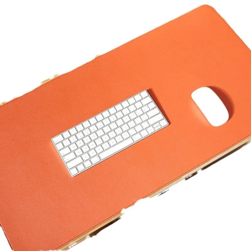 Leather cork PVC mouse mat in orange, 3.8mm thick, 80x40cm, on a wooden desk with a laptop and mouse