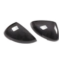 True carbon fibre exterior rearview mirror covers for a black Porsche Macan.