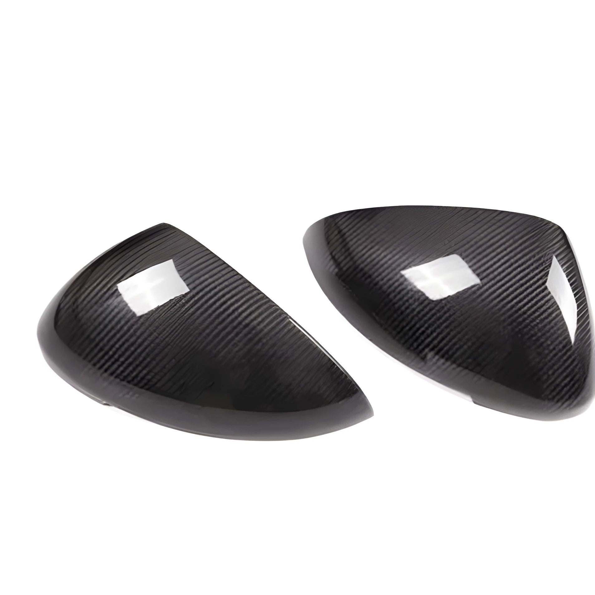 True carbon fibre exterior rearview mirror covers for a black Porsche Macan.
