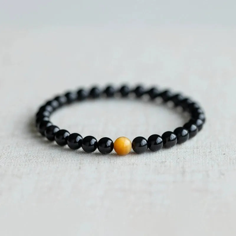 Geometric cut black obsidian stone bracelet showing 6mm, 8mm, and 10mm size beads.
