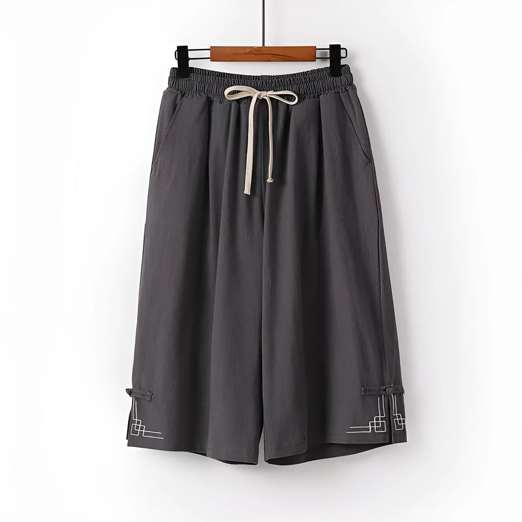 Women's wide leg linen leisure shorts in apricot colour with embroidery detail.