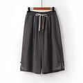 Women's wide leg linen leisure shorts in apricot colour with embroidery detail.