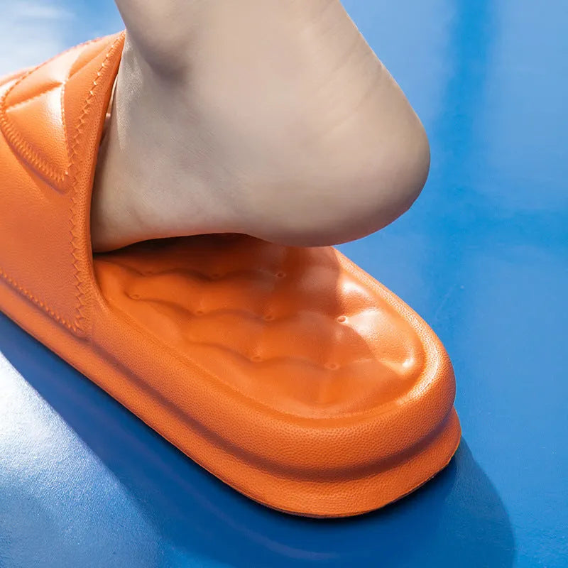 A pair of thick-soled EVA bathroom slippers in a choice of colours, showing non-slip sole texture.