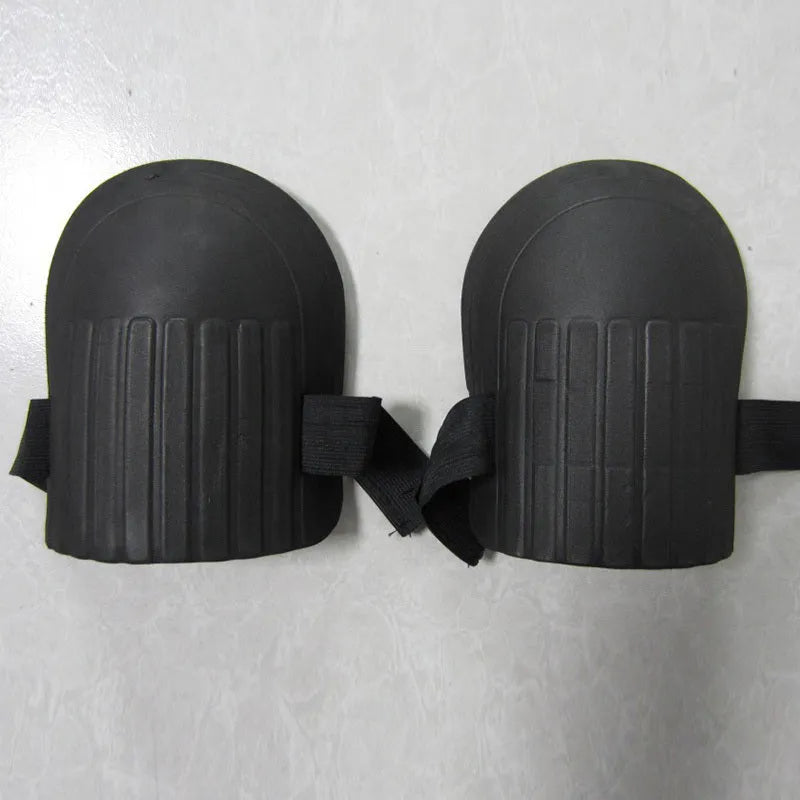 A pair of EVA foam knee pads in army green colour, showing their rectangular shape and thickness.