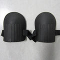 A pair of EVA foam knee pads in army green colour, showing their rectangular shape and thickness.