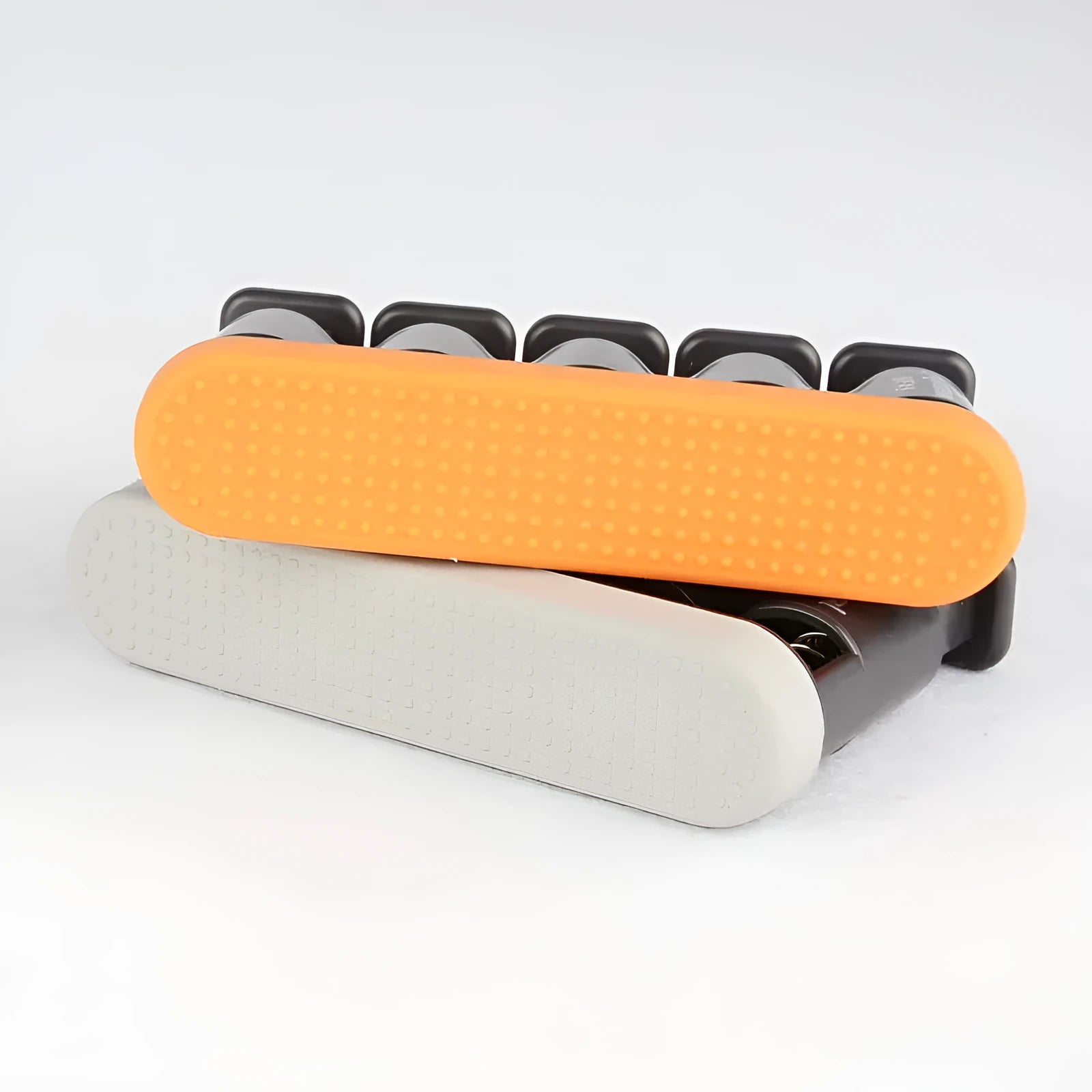 Grey and orange non-slip silicone finger trainer for hand exercise.