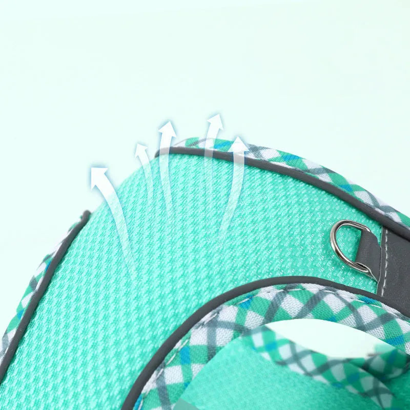 Step-in no-pull dog harness with attached leash, made from breathable mesh with reflective strips and a plastic quick-release buckle.
