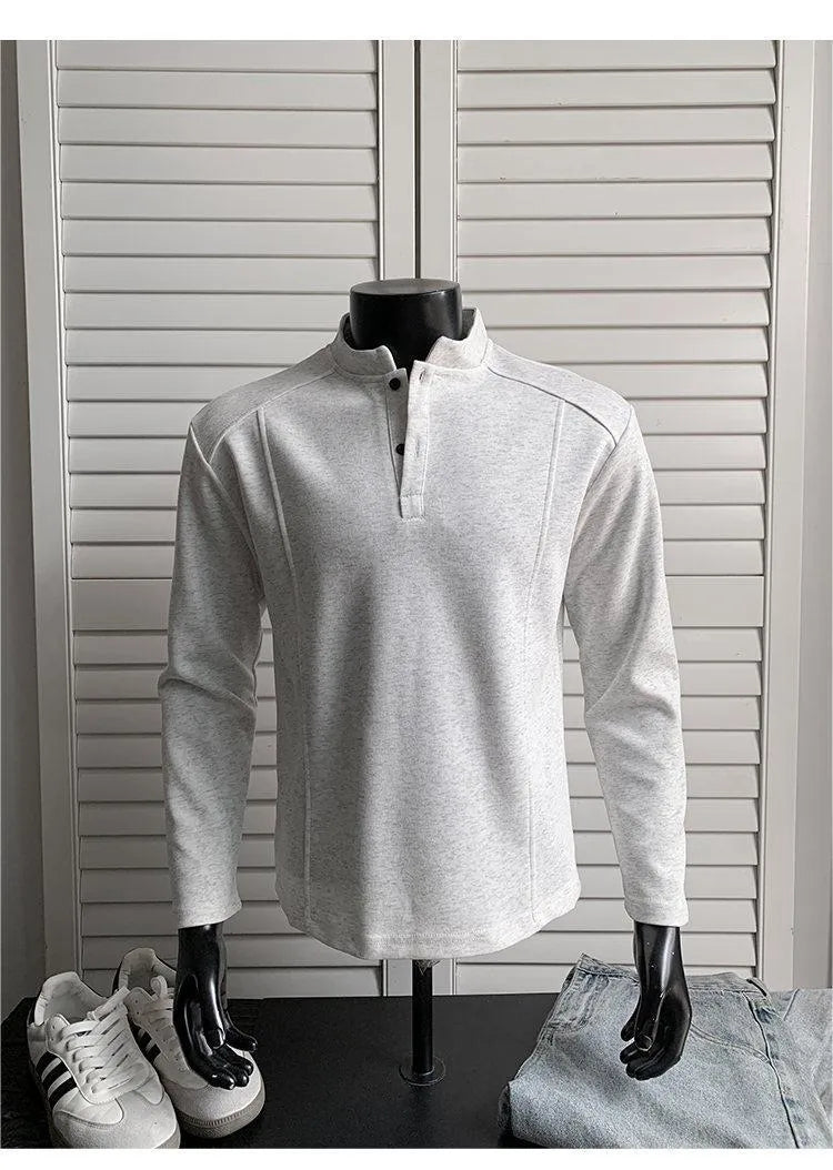 Men's grey polo shirt with patchwork detailing on shoulders and stand-up collar