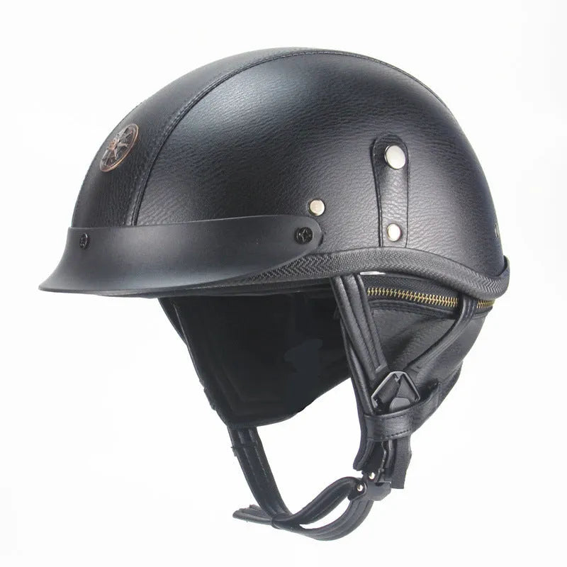 Black retro handmade leather half helmet for motorcycles on a plain background.