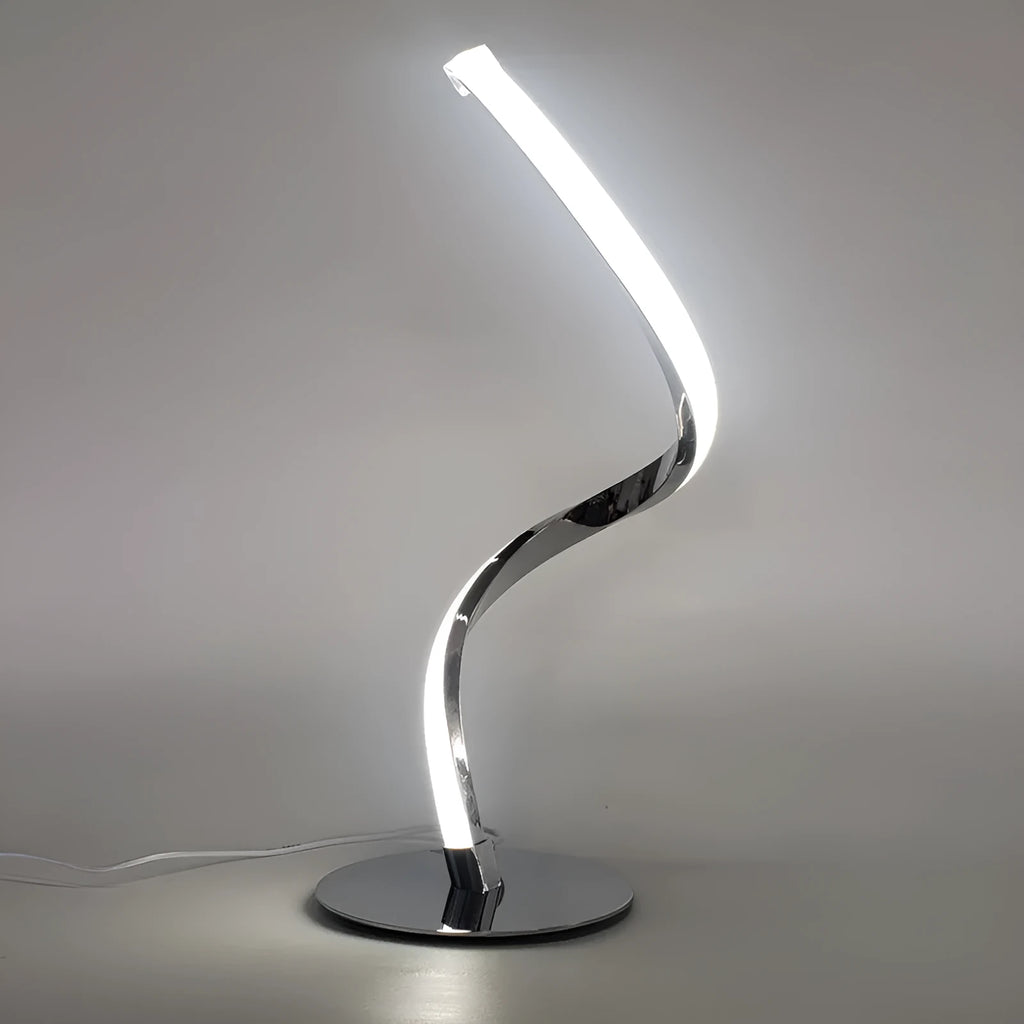 Advanced touch dimming desk lamp in white with white light mode on a bedside table