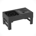 Adjustable height black and grey plastic dog feeder stand with two stainless steel bowls at medium setting