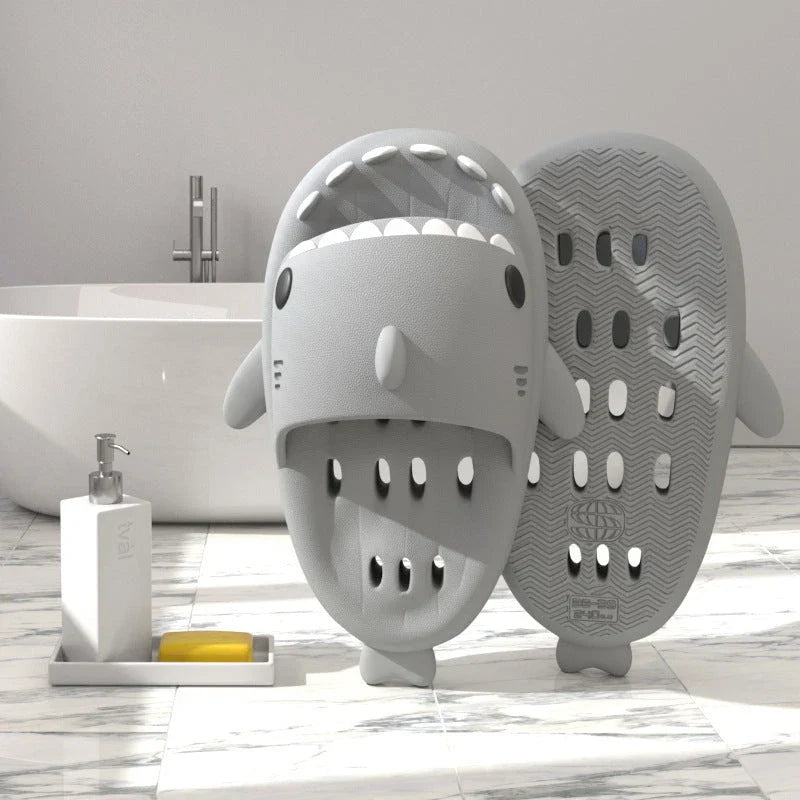 Shark-inspired shower slides with drain holes, featuring authentic shark design details and quick-drying EVA material