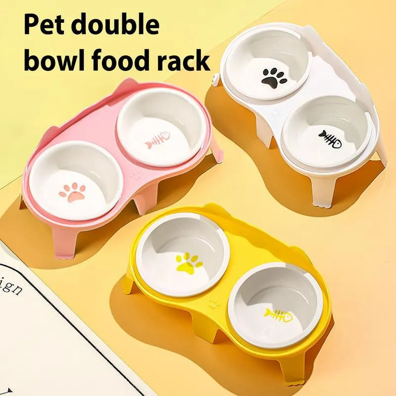 Blue ceramic cat food and water bowls in a white elevated plastic stand with a hook.