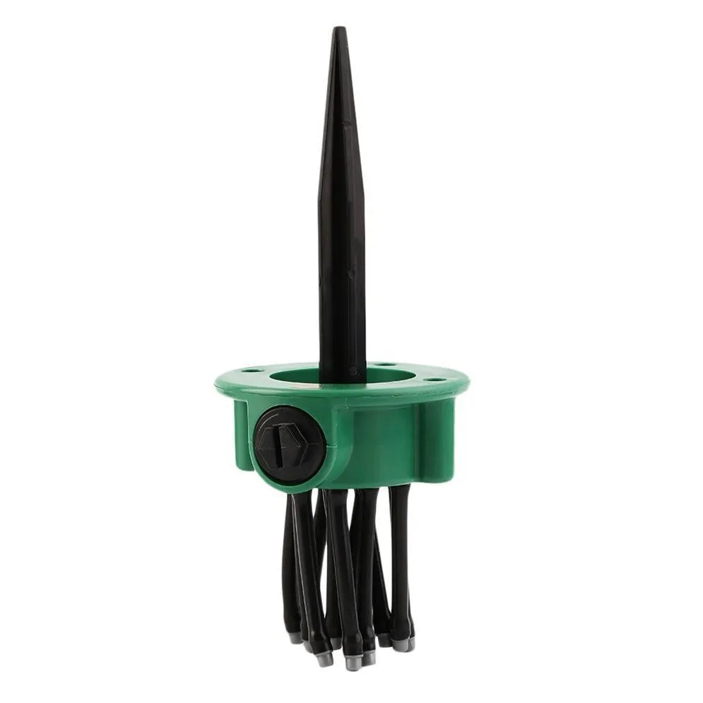 Green adjustable lawn sprinkler with bendable spray arms on a 9cm circular base.
