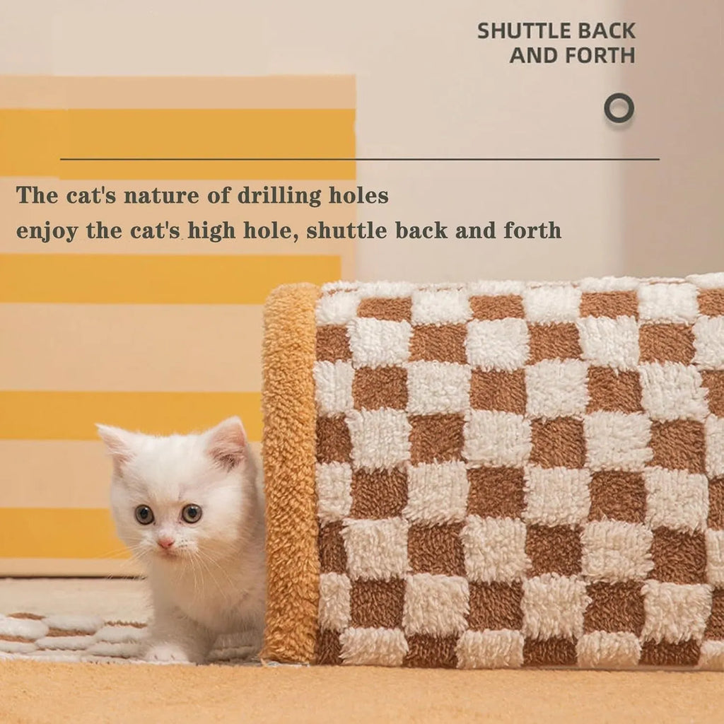 Brown plaid collapsible cat tunnel bed with central mat on a wooden floor.