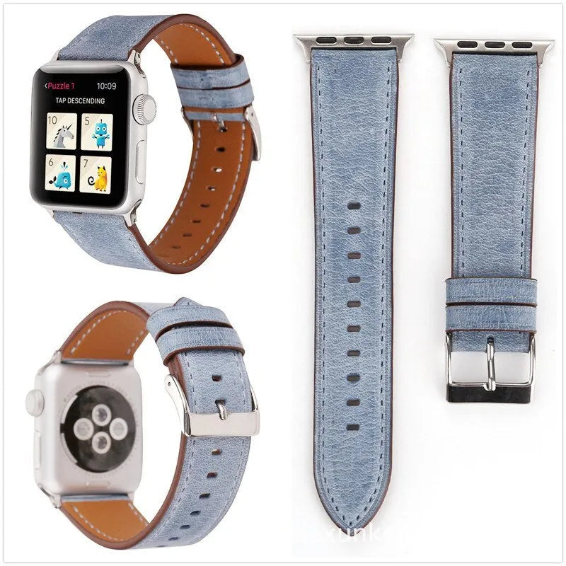 Coloured leather watch strap with a folding buckle on a watch case.