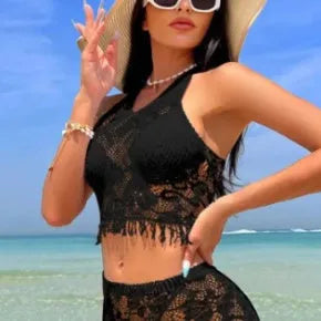 Women's white two-piece swimsuit with lace bikini top and tassel skirt beach cover-up