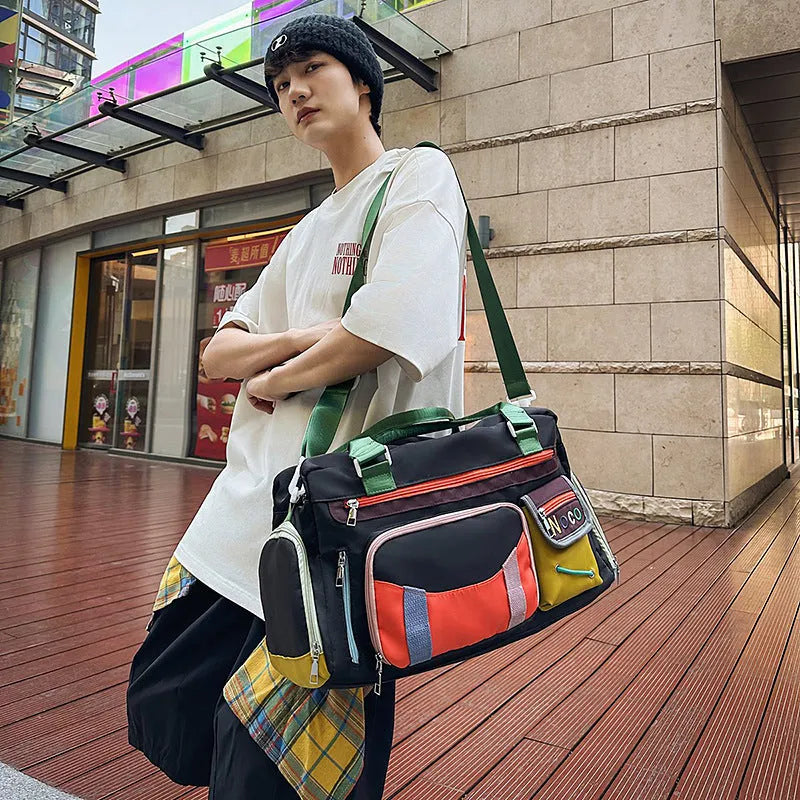 Large black sports messenger bag with shoulder strap showing spacious interior and Oxford cloth construction