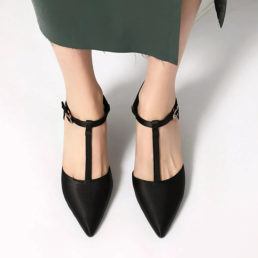 Women's pointed toe T-strap high heels in black top grain leather with unlined inner