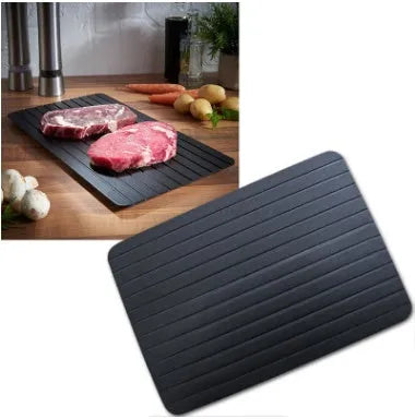 Black aluminium fast defrosting tray for kitchen use on a countertop
