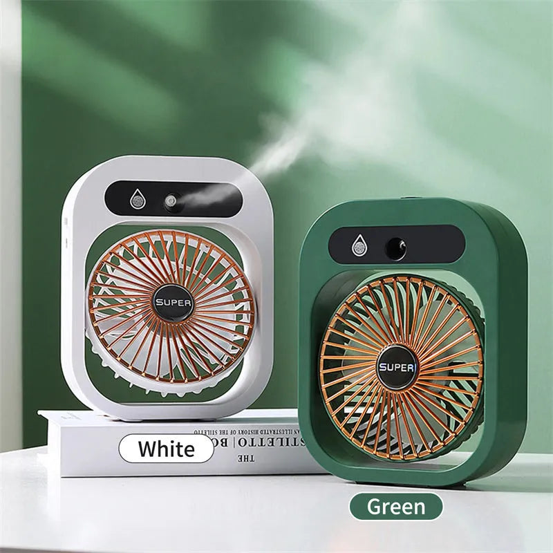 Green and white USB portable misting fan humidifier on a desk showing adjustable vent and water tank.