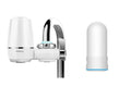 White plastic kitchen tap water filter with universal adapter and ceramic cartridge