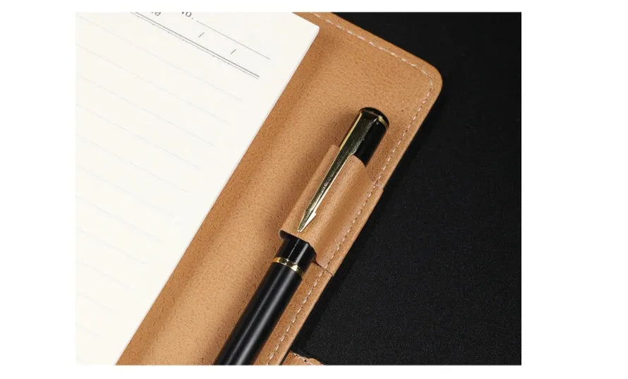 A5 leather notebook with 6-hole binder clip closure and hard cover
