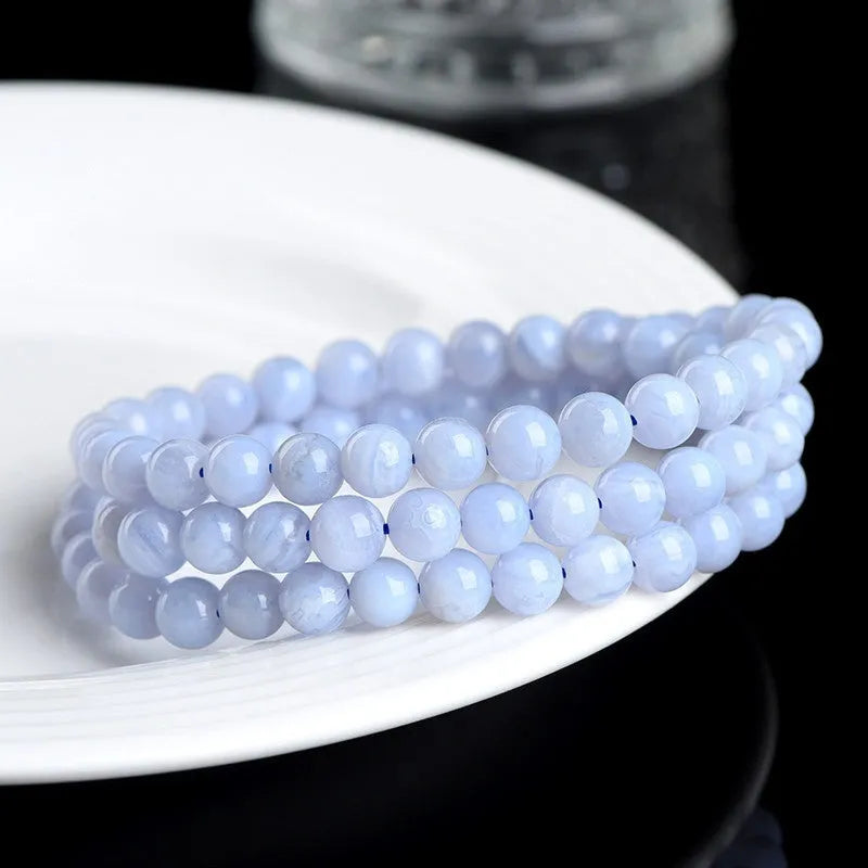 Handmade blue agate bracelet with natural pattern agate balls and striped scattered beads.