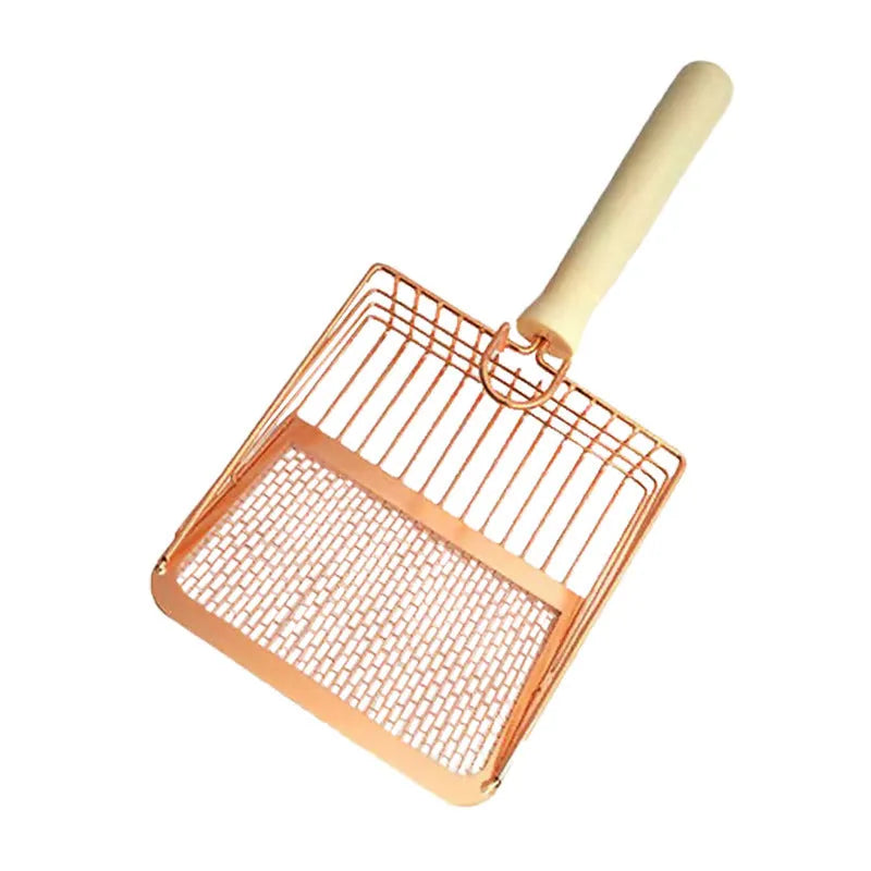 Stainless steel cat litter scoop with a long wooden handle on a litter box.