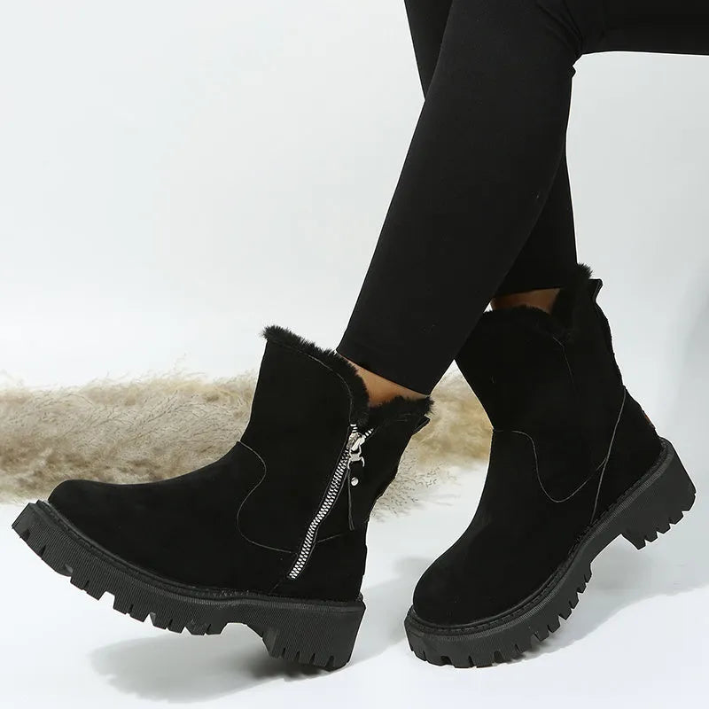 Women's black high-top snow boot with side zip, faux fur lining visible, and a rubber sole.