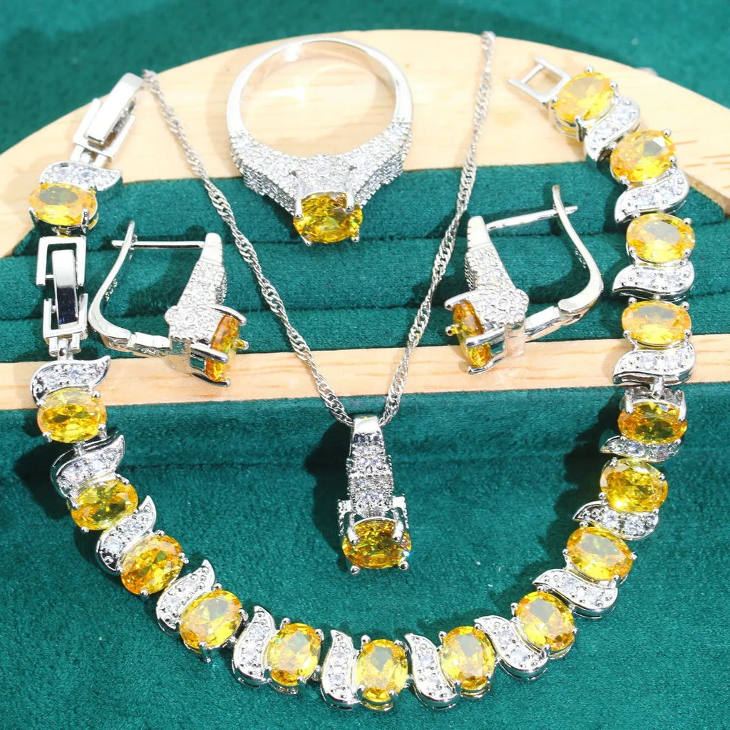 Zircon bridal jewellery four-piece set showing necklace, earrings, bracelet, and ring with alloy pendant