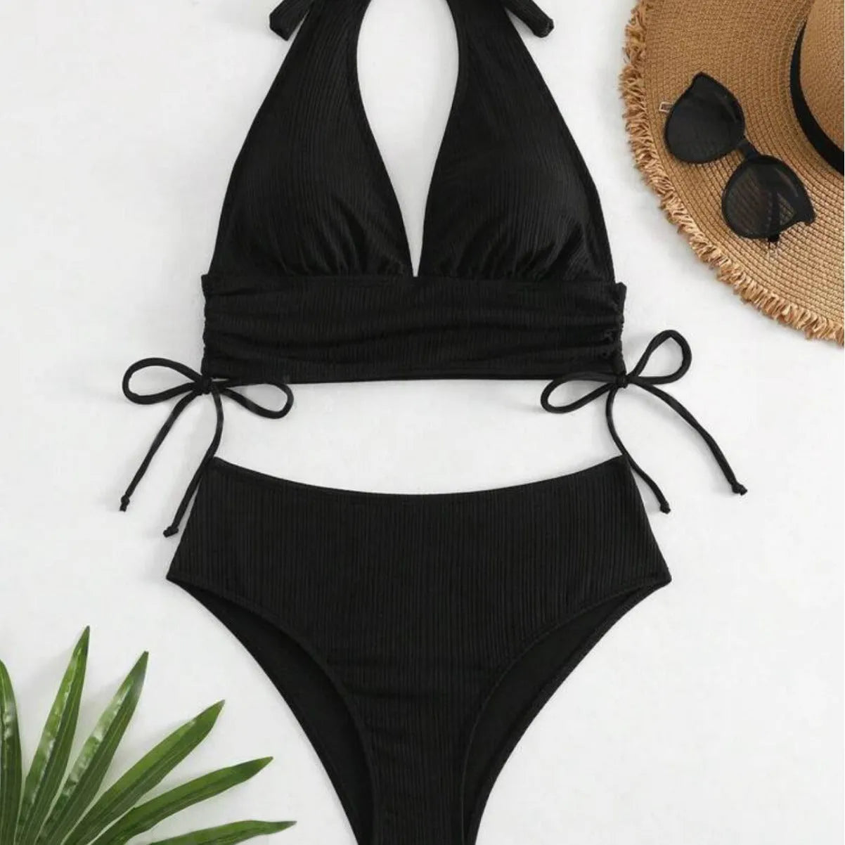 Women's black lace-up halter bikini set with adjustable straps and matching briefs