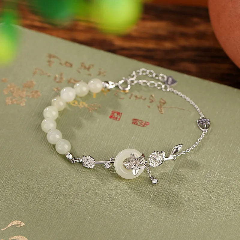 Women's antique silver bracelet with peace buckle clasp and inlaid Hetian jade lotus charm