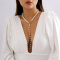 Round bead chain imitation pearl pendant necklace in gold tone with metal construction