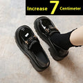 Black women's slip-on shoes with a skull pattern, chunky square heel, and round toe on a white background.