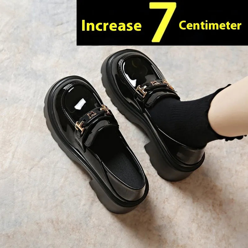 Black women's slip-on shoes with a skull pattern, chunky square heel, and round toe on a white background.